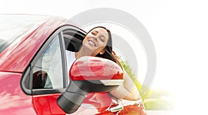 Beautiful young woman driving a car.