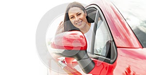 Beautiful young woman driving a car.