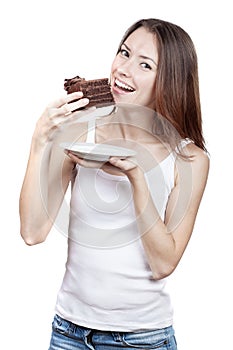Beautiful young woman eating chocolate cake