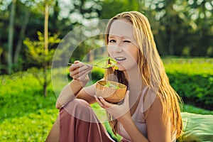 Beautiful Young Woman eating fresh vegetable salad. Loosing Weight concept