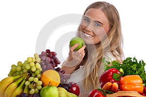 Beautiful young woman eating green apple