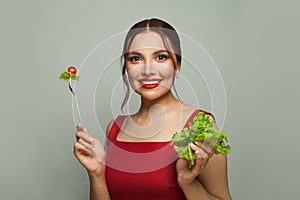 Beautiful young woman eating healthy food. Healthy eating and diet concept
