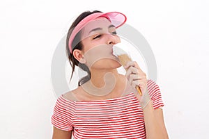Beautiful young woman eating ice cream