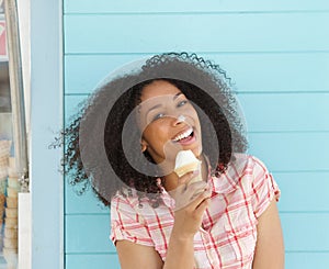 Beautiful young woman eating ice cream