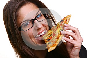 Beautiful young woman eating pizza