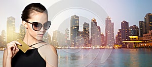 Beautiful young woman in elegant black sunglasses