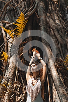 Beautiful young woman in elegant dress at nature background