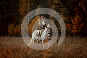 Beautiful young woman in English hunter wear style with Knabstrupper horse