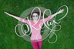 Beautiful Young Woman Enjoy Nature. Healthy Smiling Girl in Green Grass and calligraphy lettering word Relax