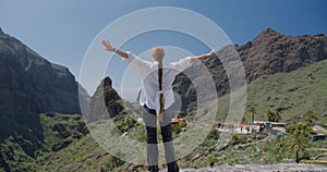 Beautiful young woman enjoying Masca Gorge and village on Tenerife Island, Canary Islands, Spain