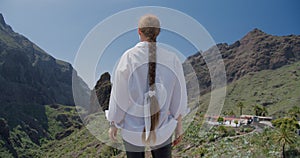 Beautiful young woman enjoying Masca Gorge and village on Tenerife Island, Canary Islands, Spain