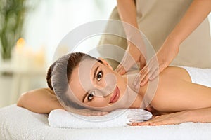 Beautiful young woman enjoying massage