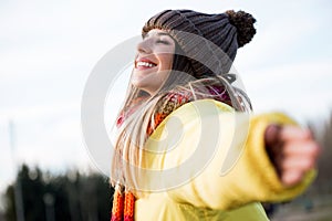 Beautiful young woman enjoying nature in the park.