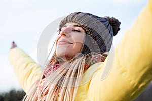 Beautiful young woman enjoying nature in the park.