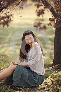 Woman Outdoors in Park Near Spring Blossom Tree