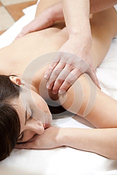 Beautiful young woman enjoys massaging