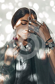 Beautiful young woman with ethnical accessories portrait photo