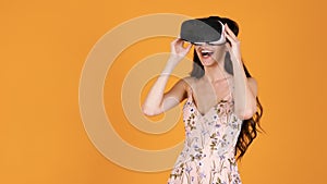 Beautiful young woman experiencing VR virtual reality for the first time