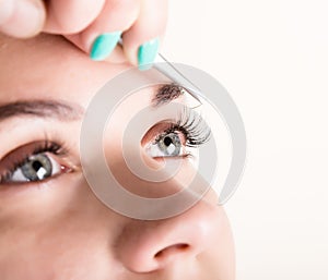 Beautiful young woman eyelash extension. Woman eye with long eyelashes. Beauty salon concept