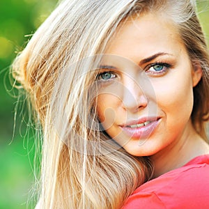 Beautiful young woman face closeup