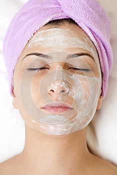 Beautiful young woman with face mask