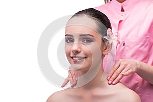 The beautiful young woman during face massage session