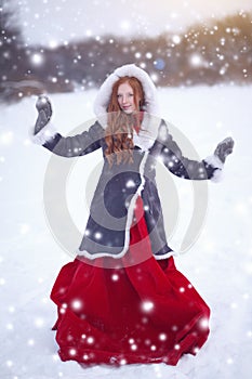 Beautiful young woman. Fairy tale girl in sheepskin coat in magic forest. Copy space. Christmas