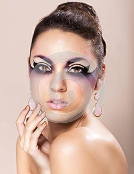 Beautiful young woman with fantasy makeup