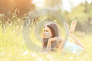 Beautiful young woman field in summer