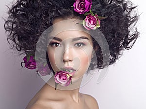 Beautiful young woman with flowers in her hair