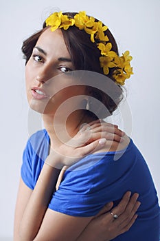 Beautiful young woman with flowers in her hair