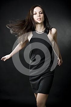 Beautiful young woman with flying hair