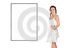 Beautiful young woman in front of a blank whiteboard