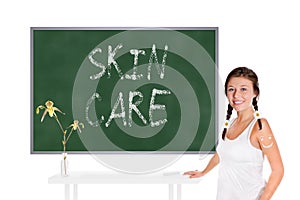 Beautiful young woman in front of a chalkboard