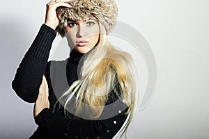 Beautiful Young Woman in Fur Hat. Pretty Blond Girl. Winter Fashion Beauty