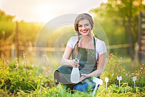 Beautiful young woman gardening