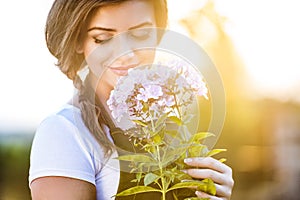 Beautiful young woman gardening