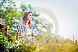 Beautiful young woman gardening