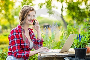 Beautiful young woman gardening