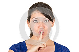 Beautiful young woman gesturing silence shhh with