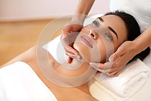 Beautiful Young Woman Getting a Face Treatment at Beauty Salon.