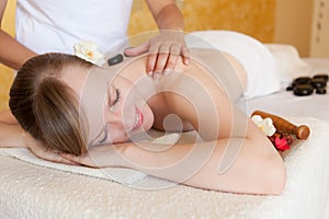 Beautiful Young Woman Getting Hot Stone Massage