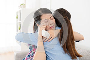 Beautiful young woman giving embracing for girl