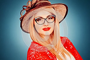 Beautiful young woman with glasses and hat, retro style