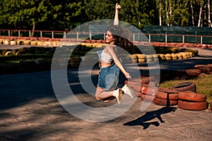 Beautiful young woman on the go-kart track