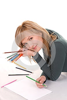 Beautiful young woman is going to draw.