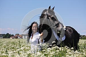 Beautiful young woman and gray horse portrait