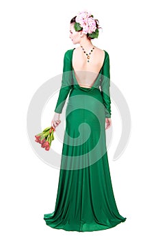 Beautiful young woman in a green evening dress