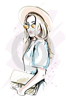 Beautiful young woman in hat. Fashion lady in sunglasses. Stylish woman portrait. Sketch.