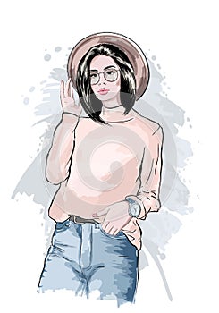 Beautiful young woman in hat. Stylish girl in eyeglasses. Fashion women look. Sketch. Hand drawn vector illustration